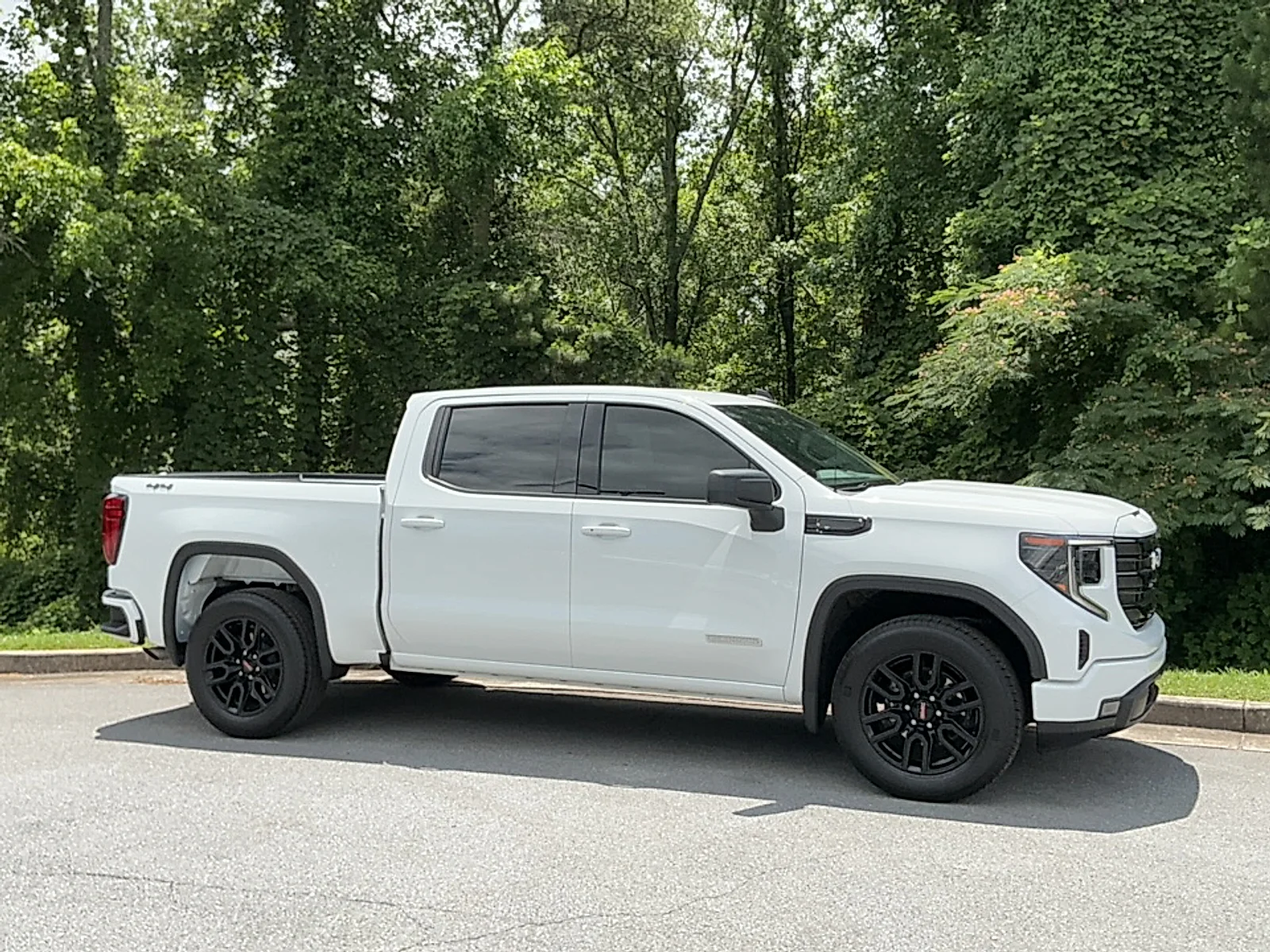 Used 2024 Summit White GMC 4WD Crew Cab Short Box Elevation with 3SB image 1