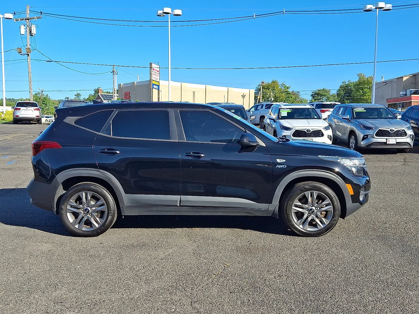 Used 2021 Cherry Black Kia LX image 8