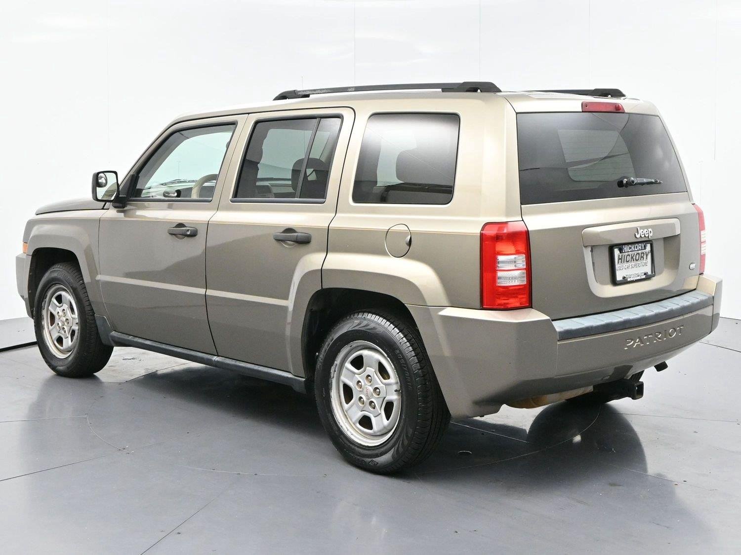 Used 2008 Light Khaki Metallic Jeep Sport image 5