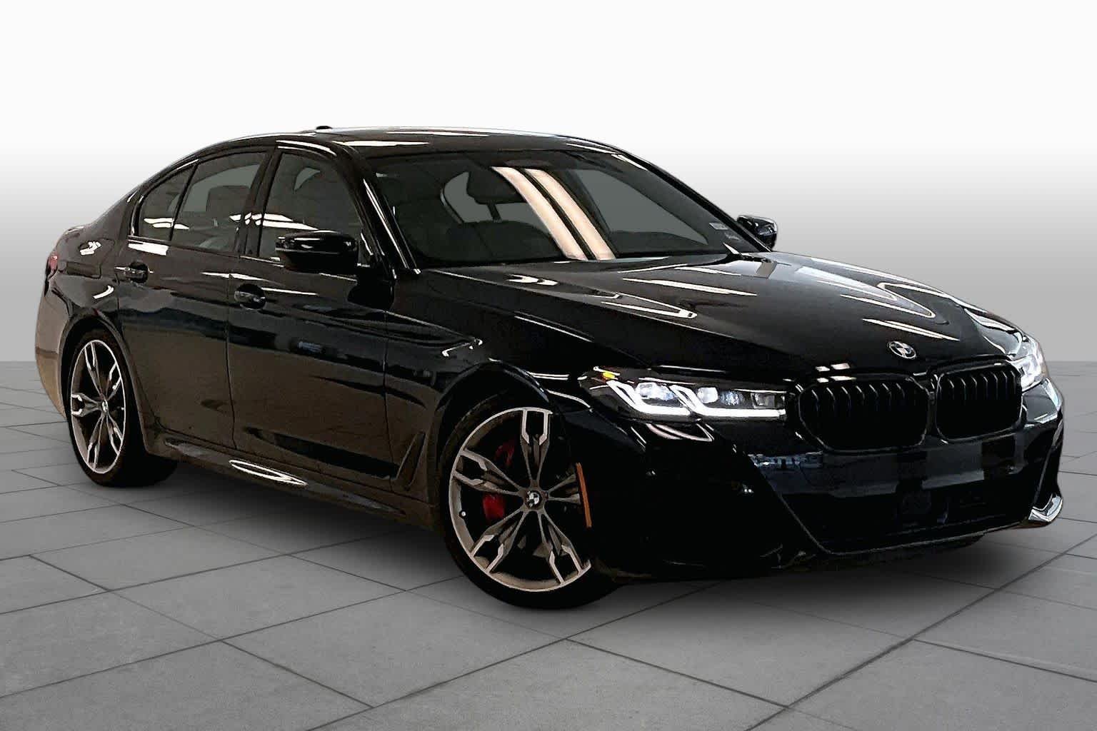 Used 2023 Carbon Black Metallic BMW M550i xDrive image 2