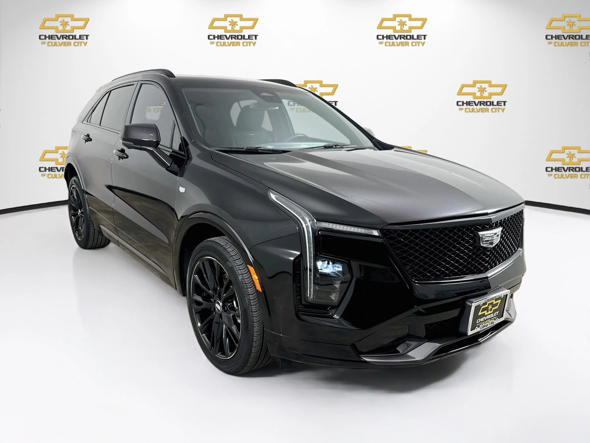 Used 2025 Stellar Black Metallic Cadillac Sport image 1