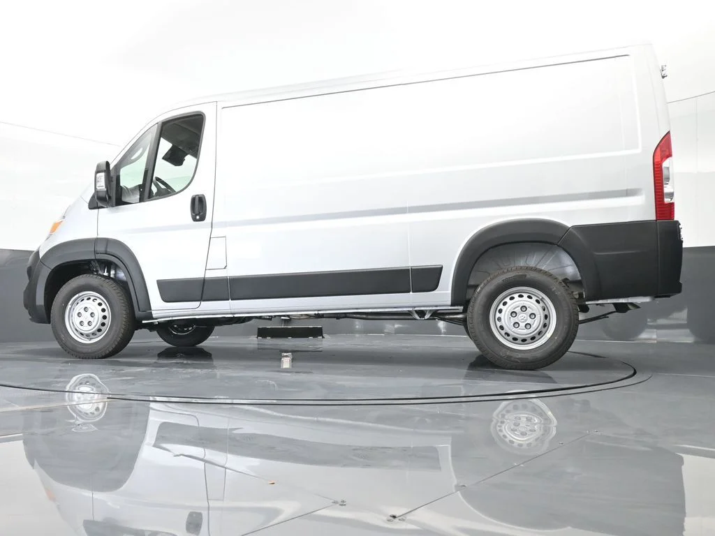 Used 2025 Bright Silver Clearcoat Metallic Ram Low Roof image 49