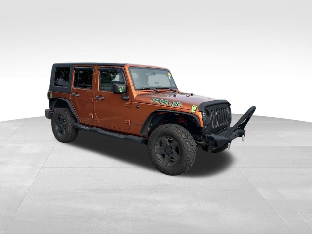 Used 2010 Orange Jeep Unlimited Sport image 3
