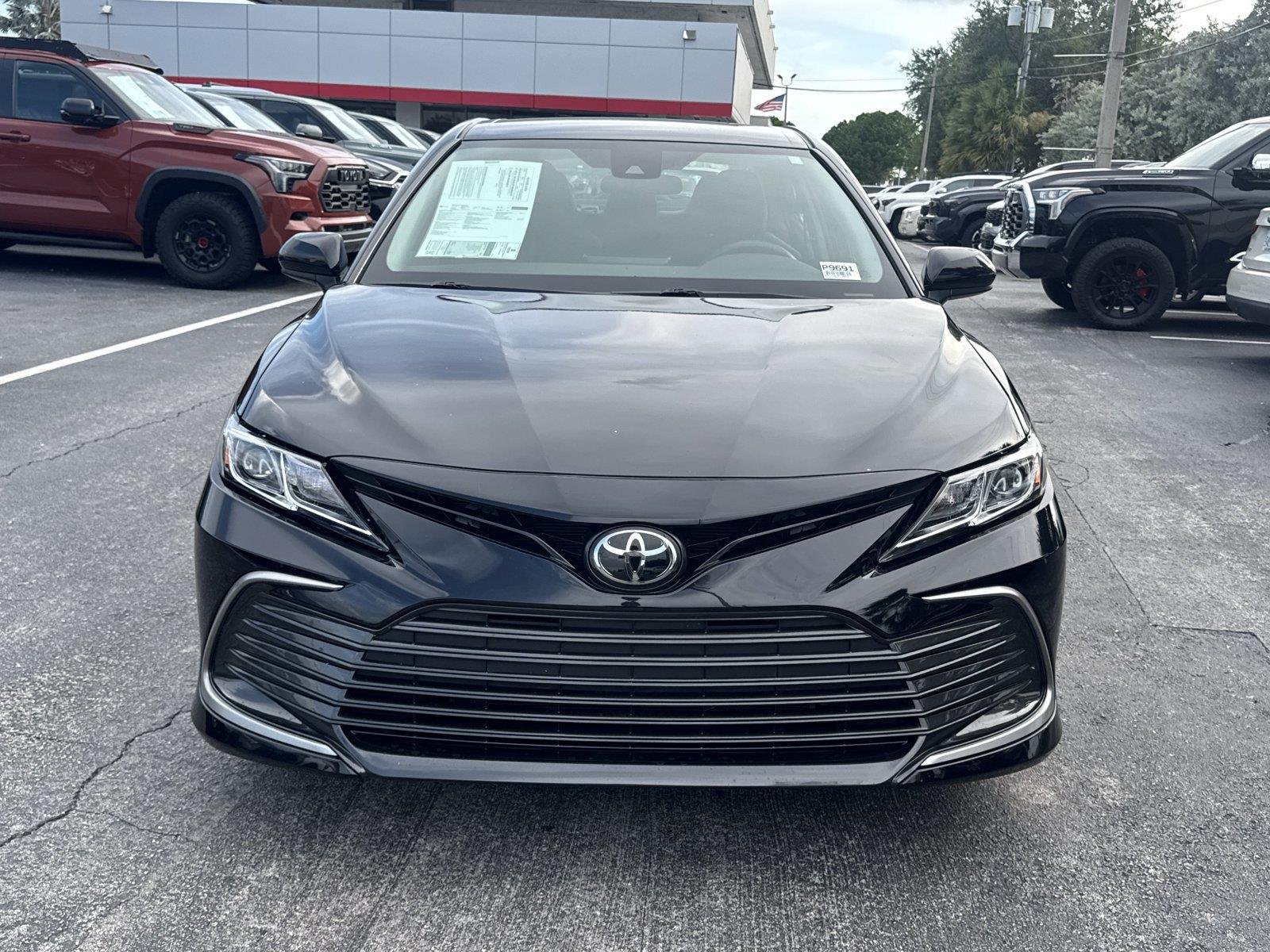 Used 2024 Midnight Black Metallic Toyota LE image 2