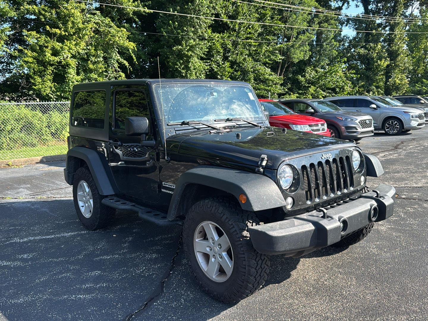 Used 2016 Black Clearcoat Jeep Sport image 1