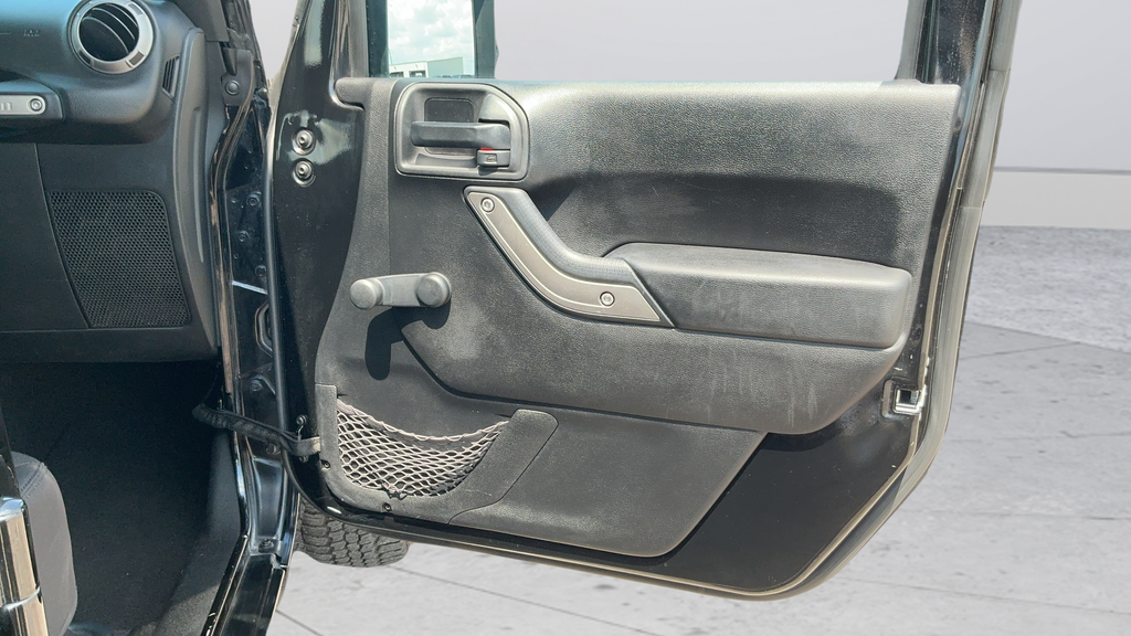 Used 2013 Black Jeep Unlimited Sport image 21