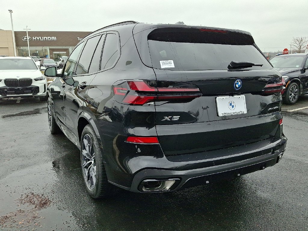 Used 2026 Black Sapphire Metallic BMW xDrive50e image 3