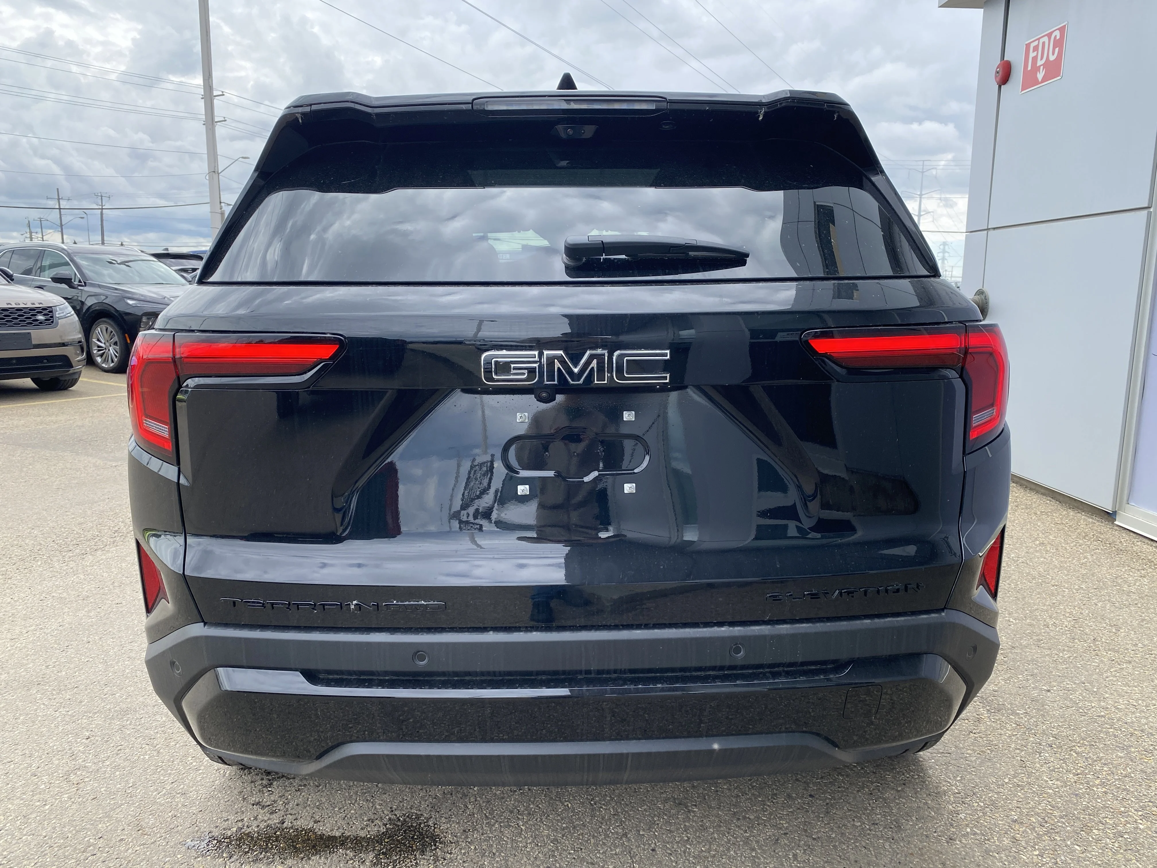 New 2026 EBONY TWILIGHT METALLIC GMC AWD Elevation image 5