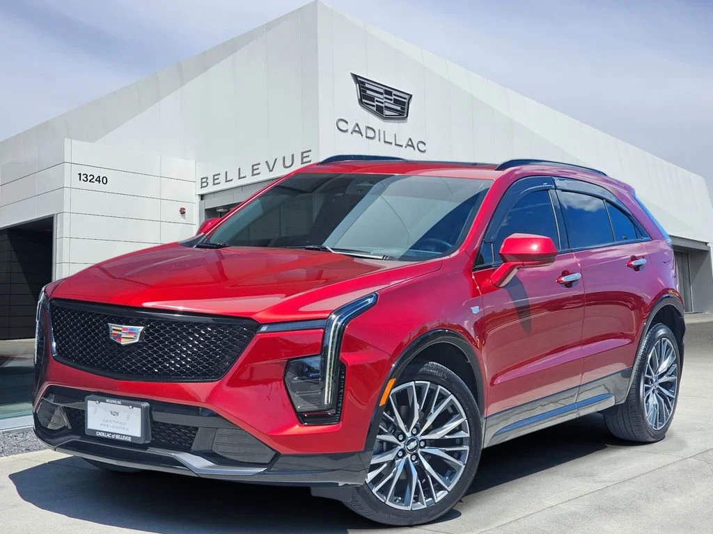 Used 2024 Radiant Red Tintcoat Cadillac Sport image 1