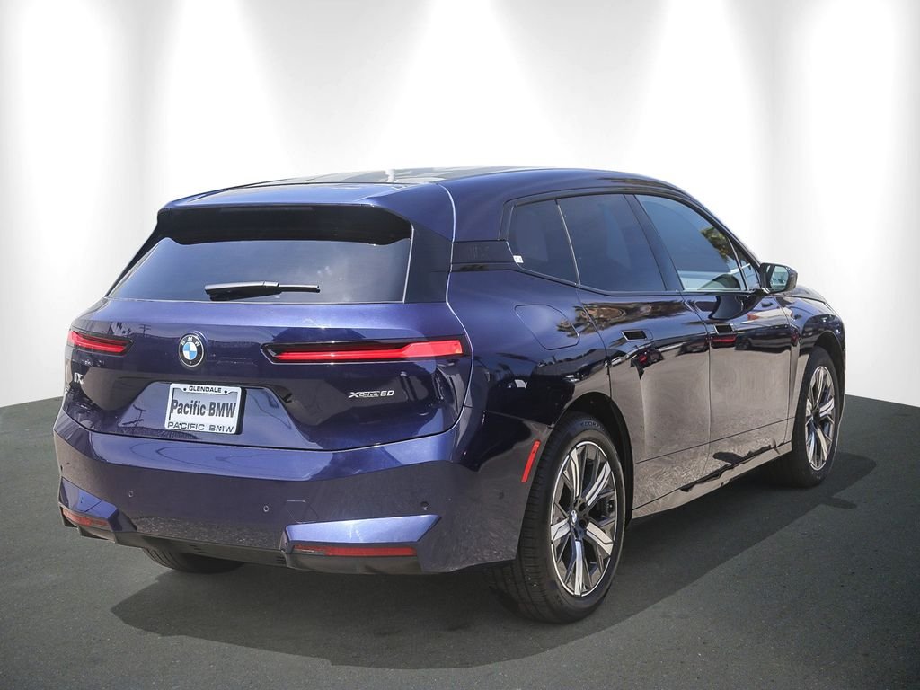 Used 2026 Tanzanite Blue II Metallic BMW xDrive60 image 6
