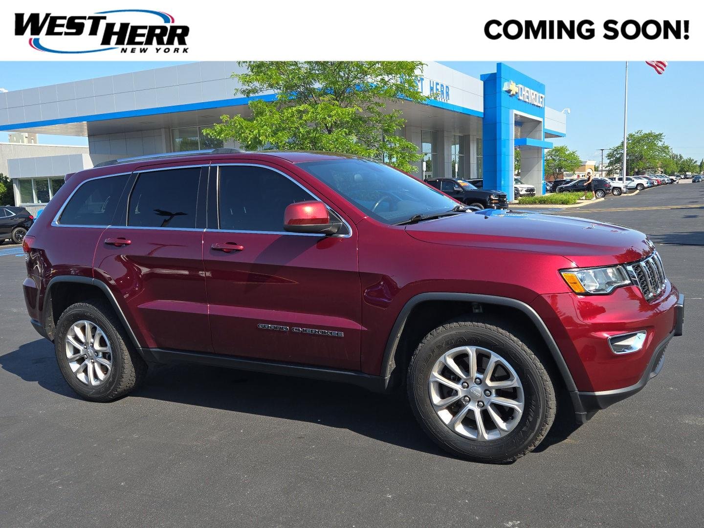 Used 2021 Velvet Red Pearlcoat Jeep Laredo E image 1