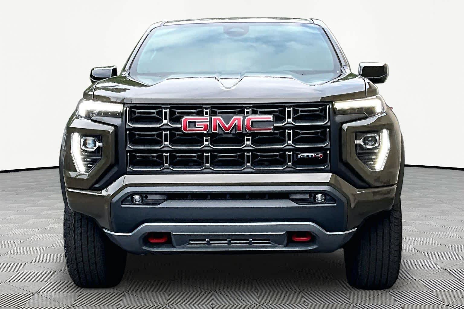 Used 2023 Deep Bronze Metallic GMC 4WD AT4 image 4