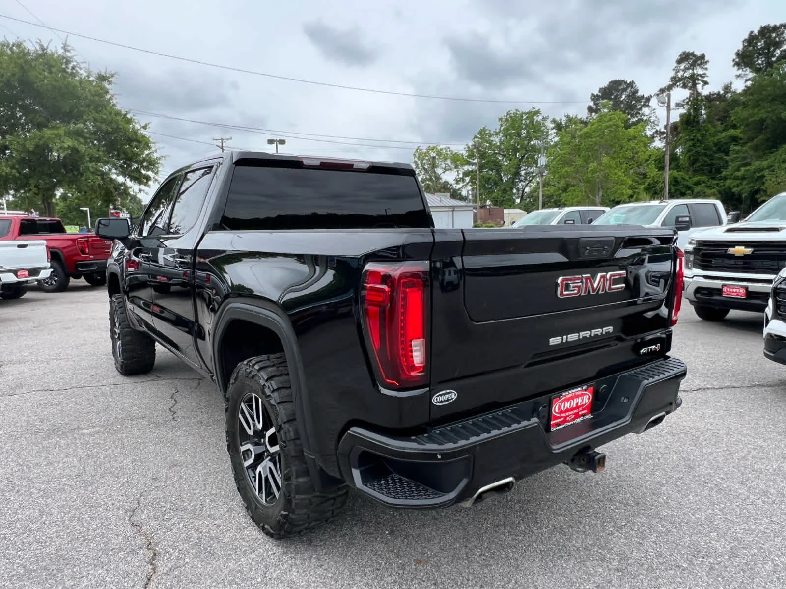 Used 2021 EBONY TWILIGHT METALLIC GMC AT4 image 4