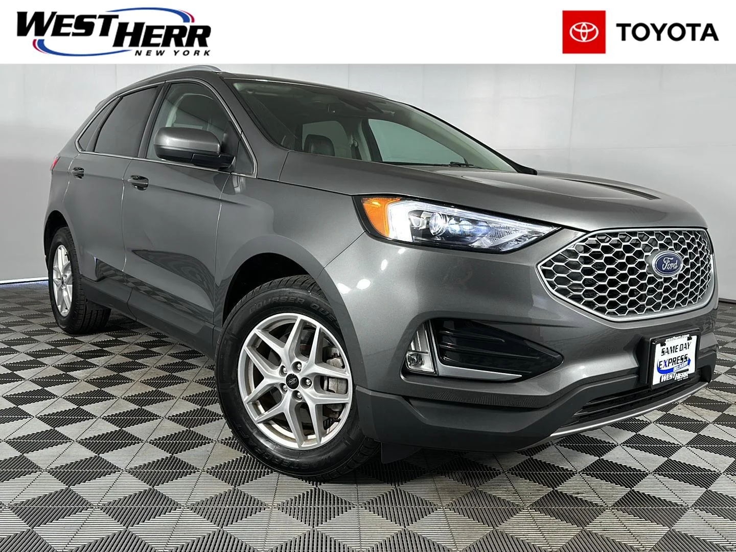 Used 2024 Carbonized Gray Ford SEL image 1