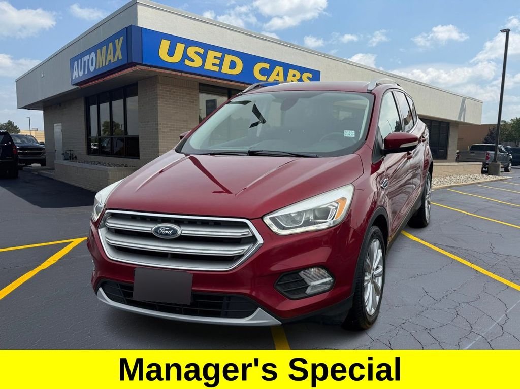 Used 2017 Ruby Red Metallic Ford Titanium image 1