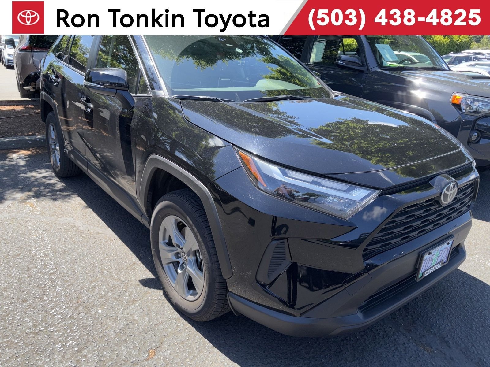 Used 2025 Midnight Black Metallic Toyota LE image 1