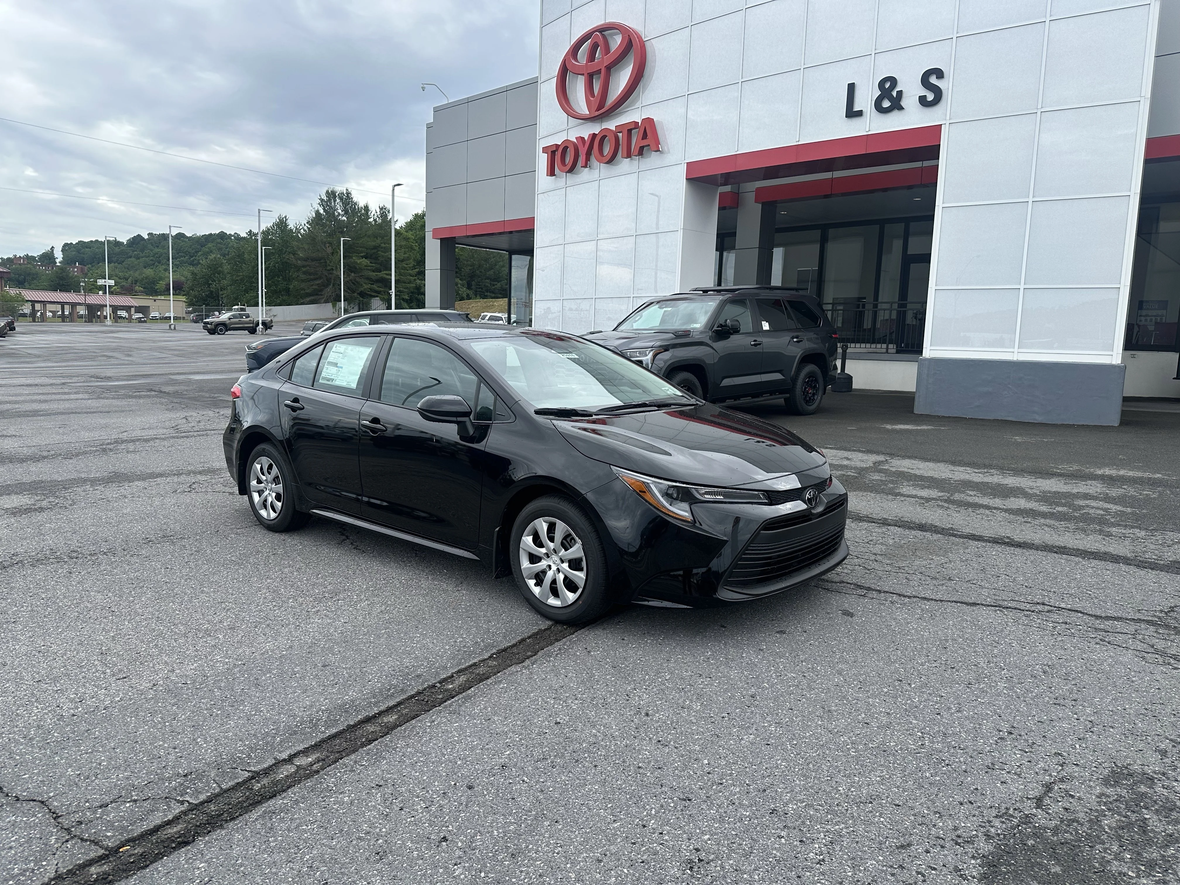 New 2026 Midnight Black Metallic Toyota LE image 1