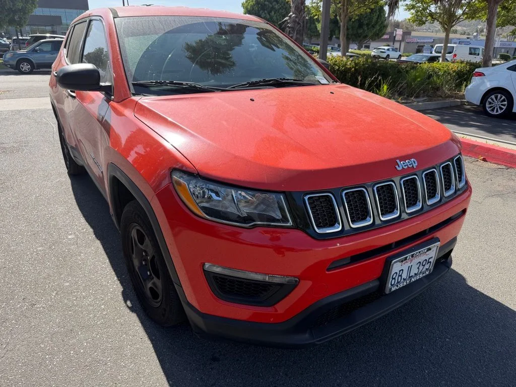 Used 2018 Orange Jeep Sport image 1