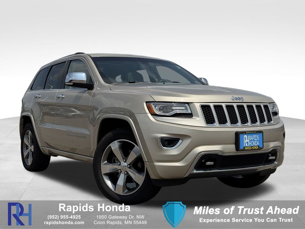 Used 2014 Cashmere Jeep Overland image 1