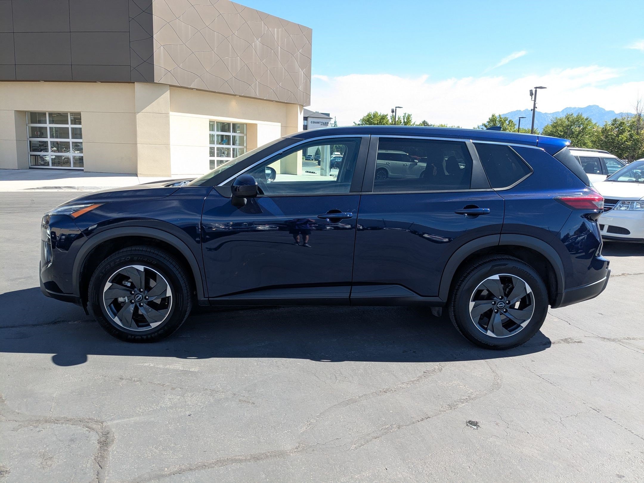 Used 2024 Deep Ocean Blue Pearl Nissan SV image 8