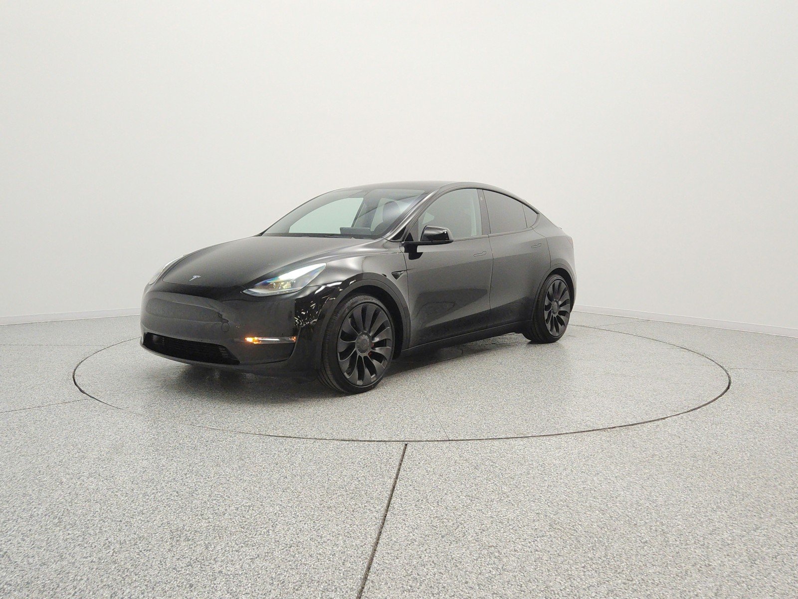 Used 2022 Solid Black Tesla Performance AWD image 1