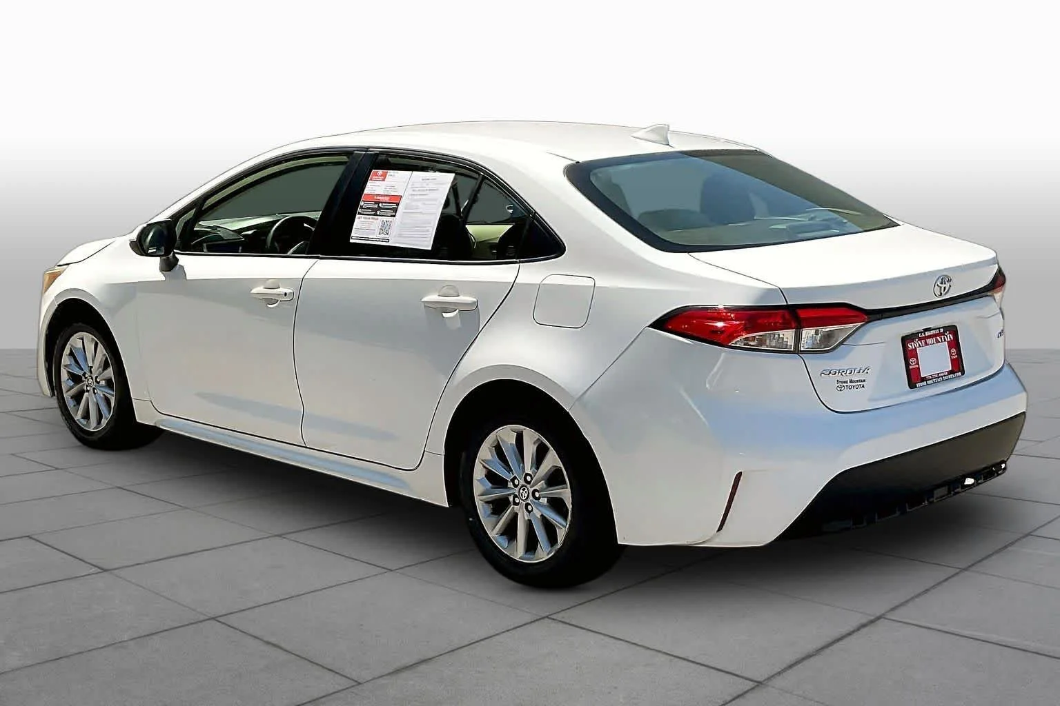 Used 2021 Super White Toyota LE image 12