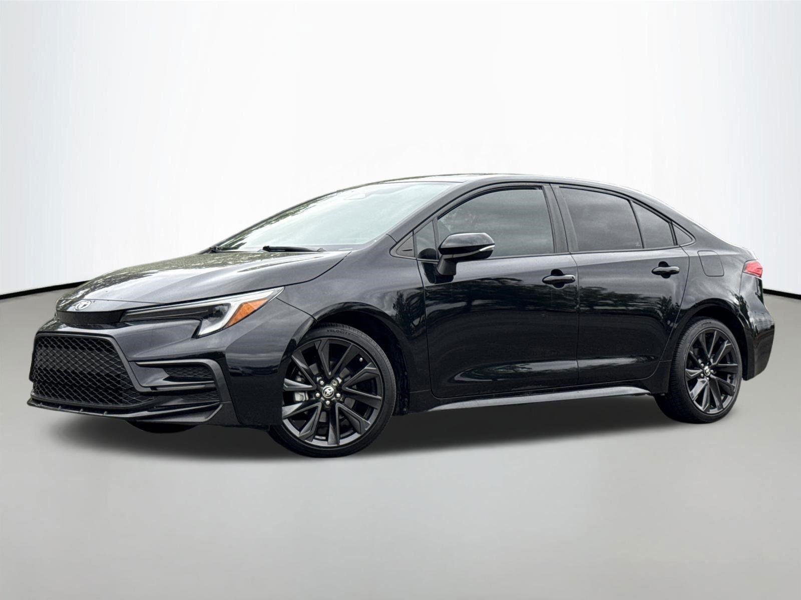 Used 2023 Midnight Black Metallic Toyota SE image 1