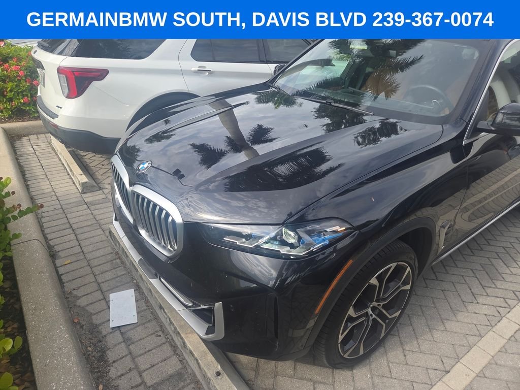 Certified Used 2024 Black Sapphire Metallic BMW sDrive40i image 1