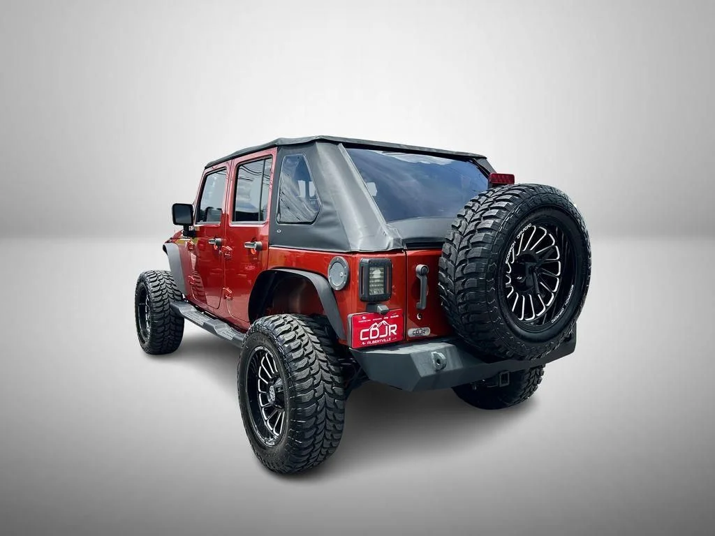 Used 2009 Orange Jeep Unlimited X image 3