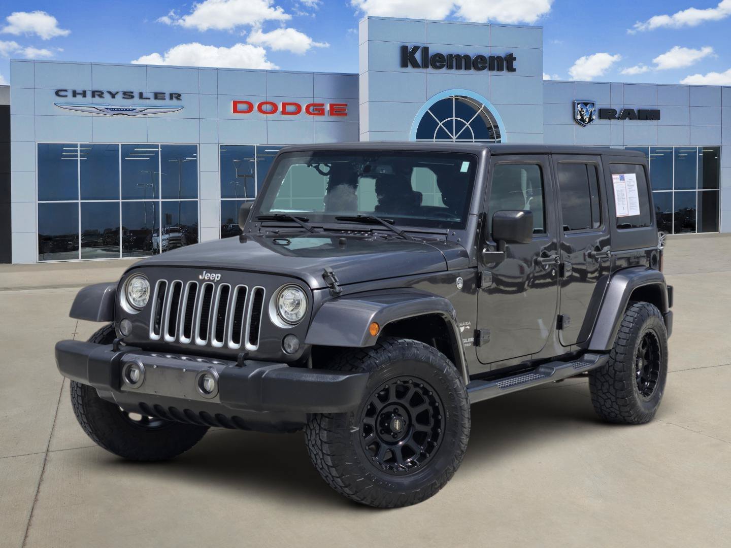 Used 2017 Granite Crystal Metallic Clearcoat Jeep Sahara image 1