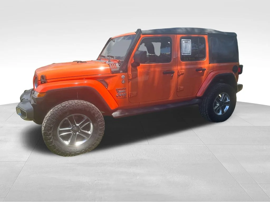 Used 2018 Orange Jeep Unlimited Sahara image 5