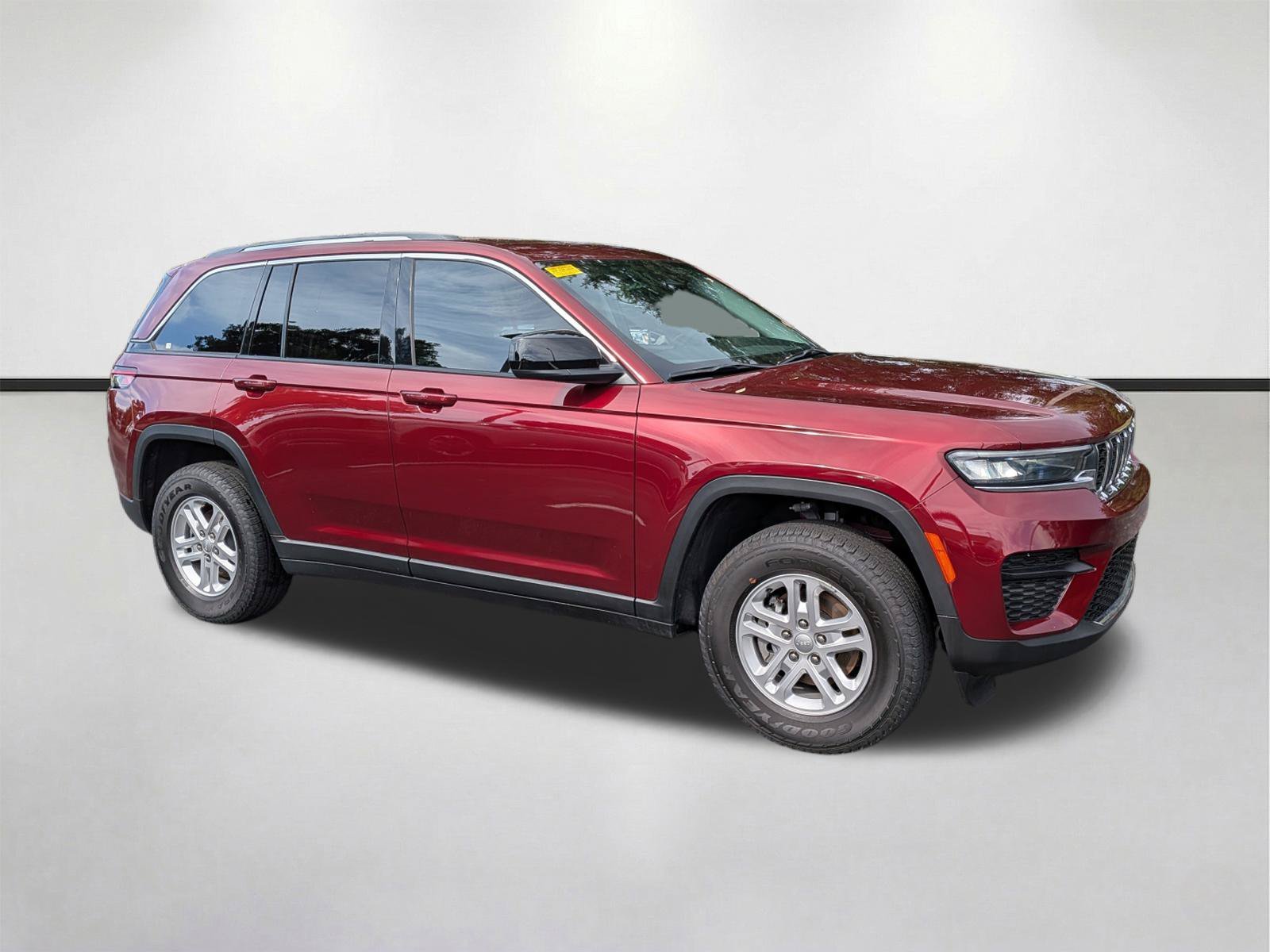 Used 2024 Velvet Red Pearlcoat Jeep Laredo image 1
