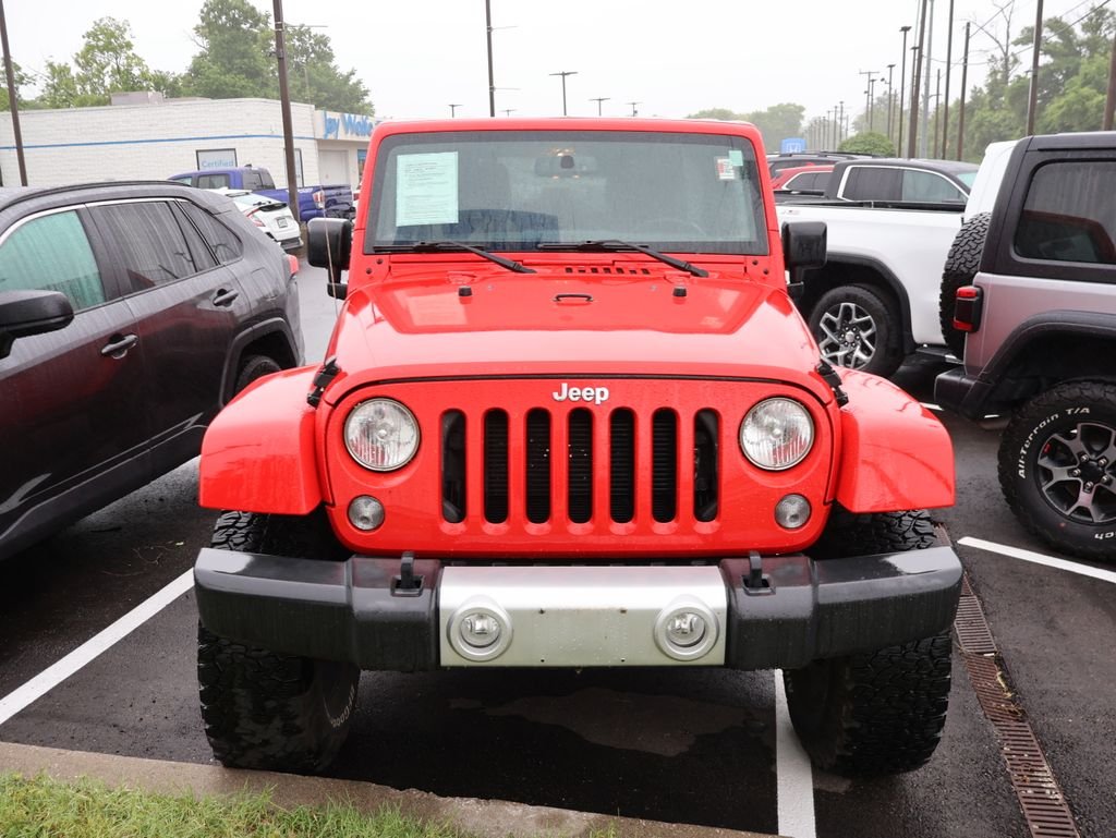 Used 2015 Red Jeep Unlimited Sahara image 2