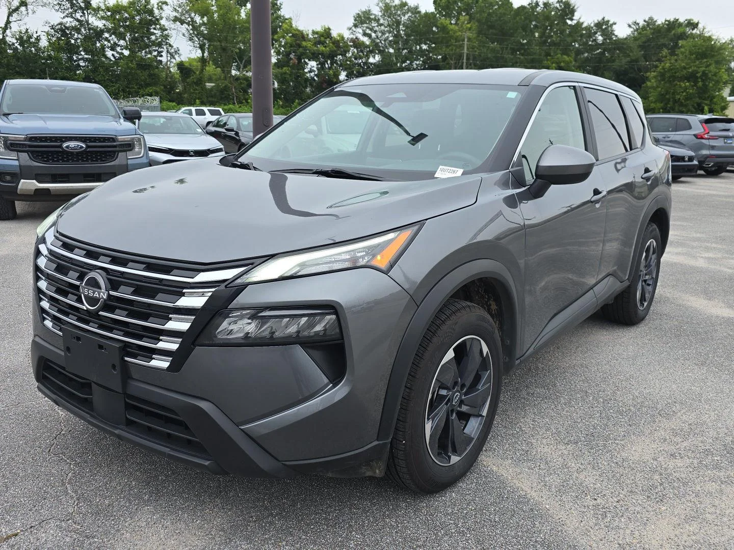 Used 2024 Gun Metallic Nissan SV image 1