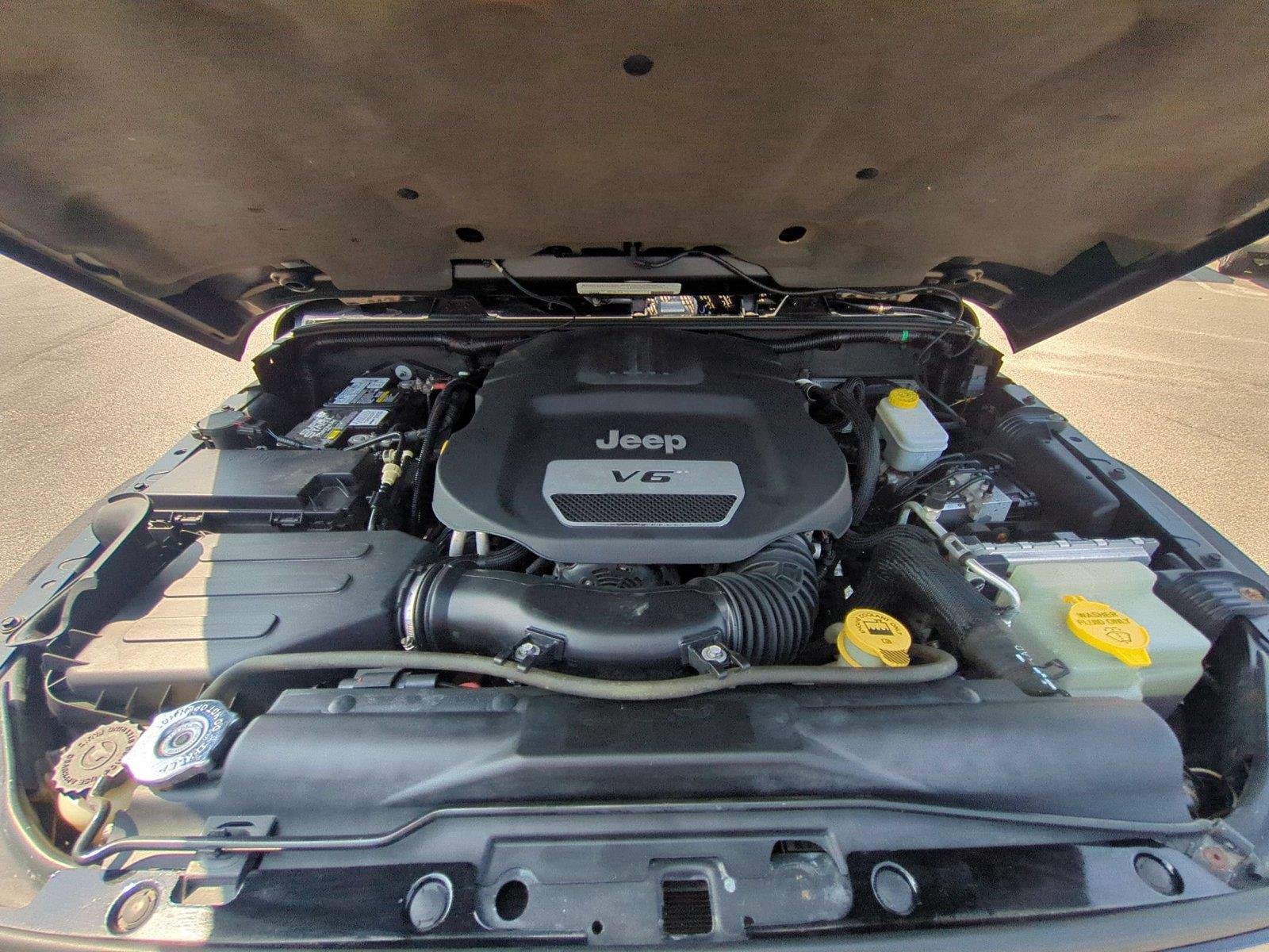 Used 2012 Black Clearcoat Jeep Sahara image 34