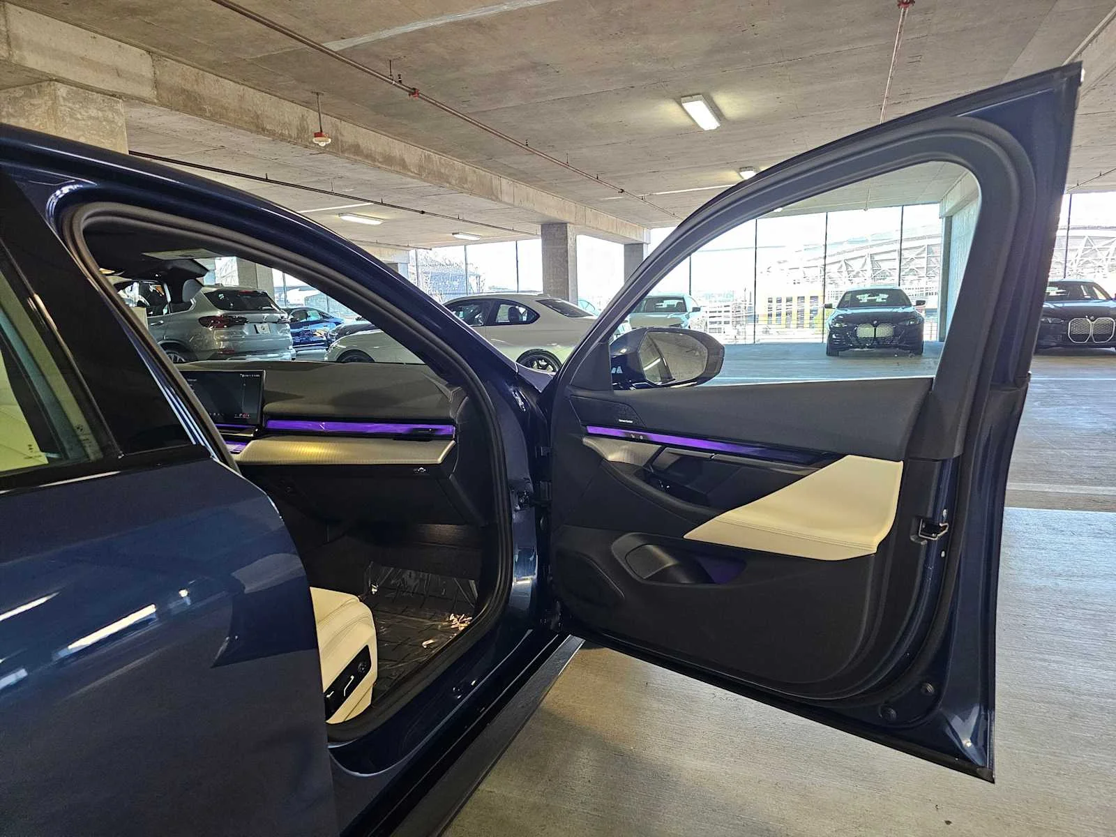 Certified Used 2026 Phytonic Blue Metallic BMW 550e xDrive image 11