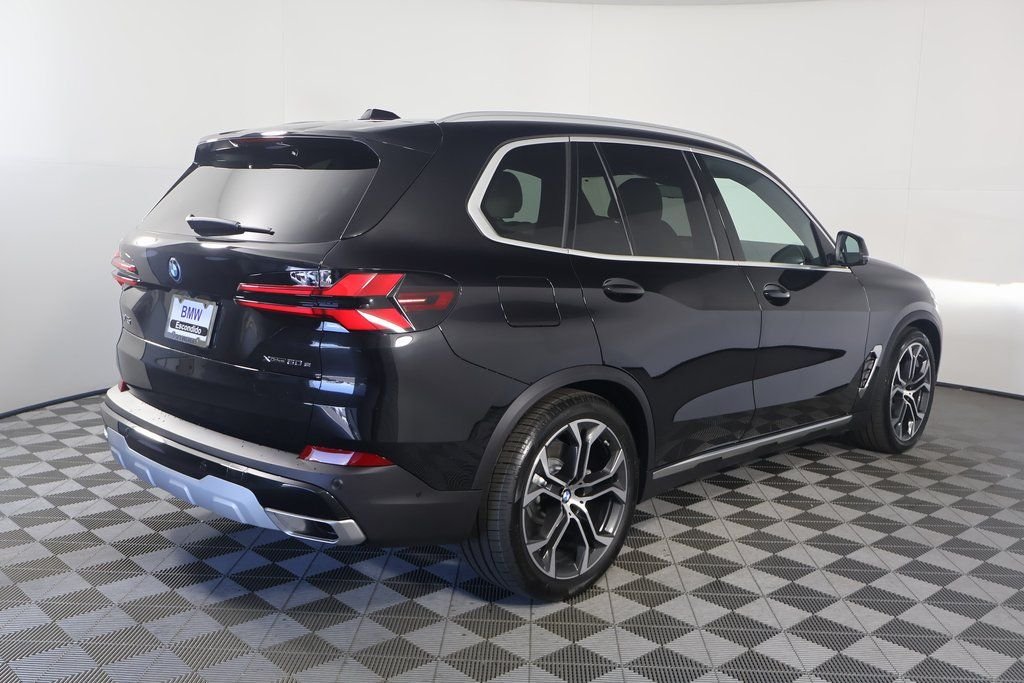 Used 2026 Black Sapphire Metallic BMW xDrive50e image 2