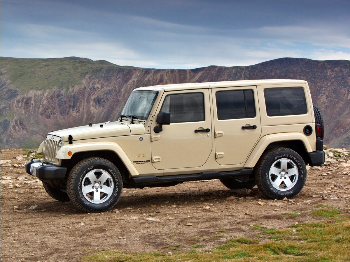 Used 2011 Black Jeep Unlimited Sport image 1