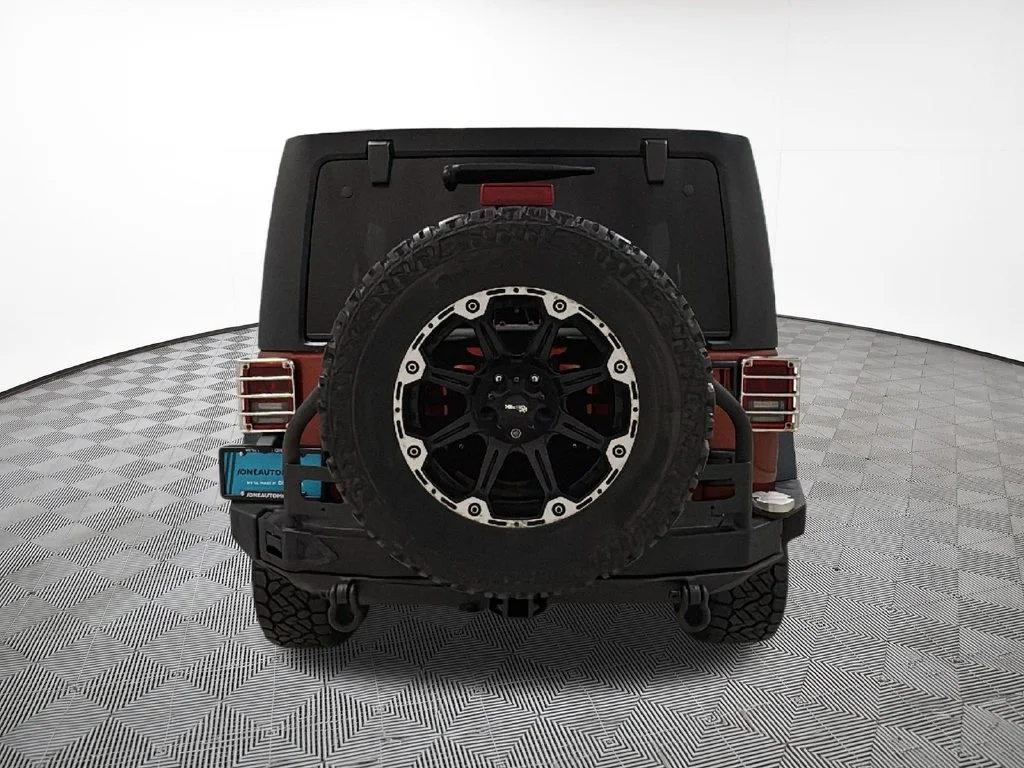 Used 2014 Orange Jeep Unlimited Sport image 10
