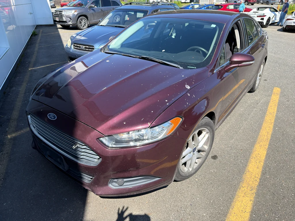 Used 2013 Ruby Red Metallic Tinted Clearcoat Ford SE image 1