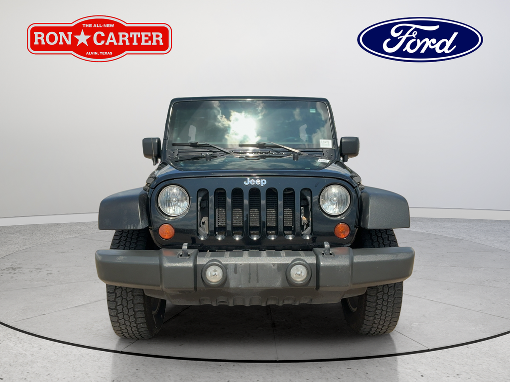 Used 2013 Black Jeep Unlimited Sport image 2