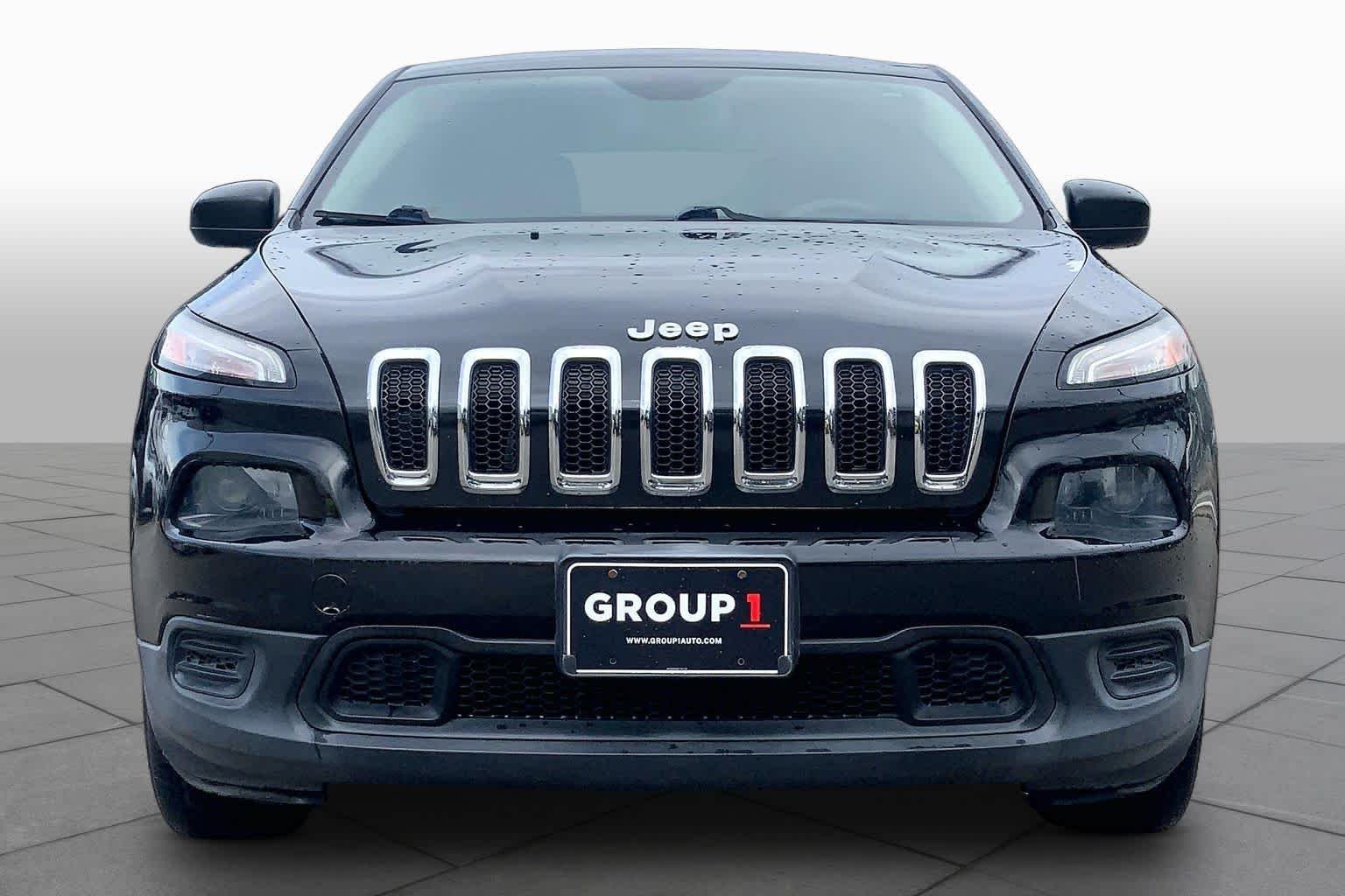 Used 2014 Brilliant Black Crystal Pearlcoat Jeep Sport image 3
