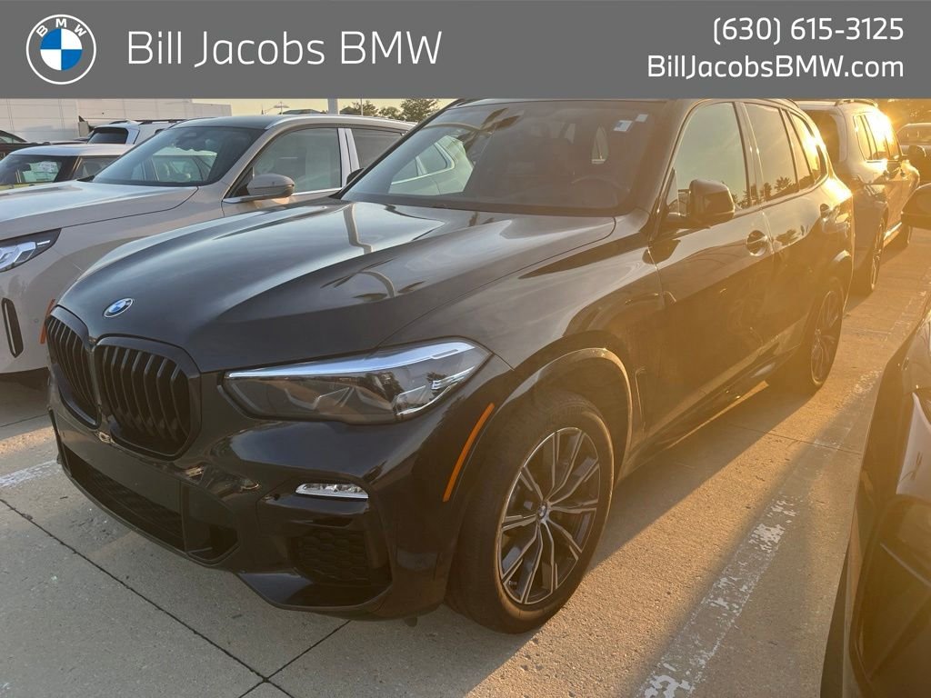 Used 2021 Black Sapphire Metallic BMW xDrive40i image 1