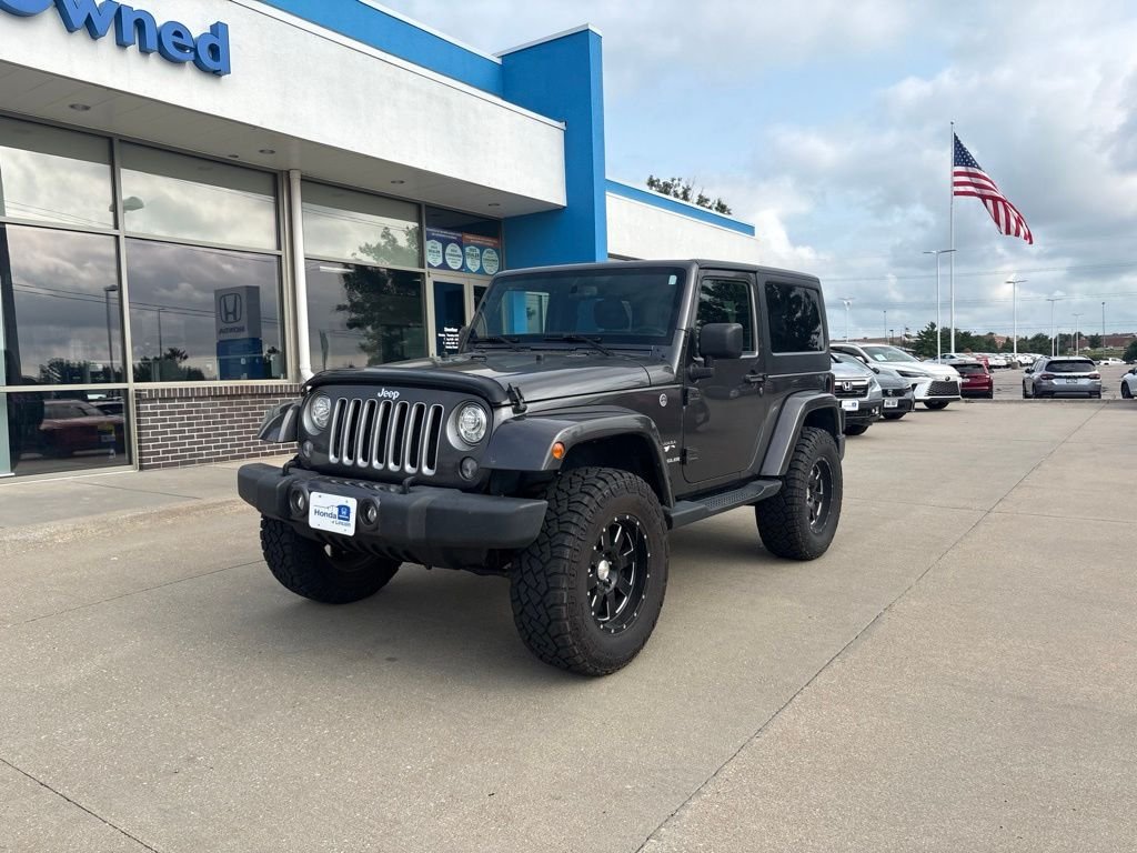 Used 2017 Granite Crystal Metallic Clearcoat Jeep Sahara image 1