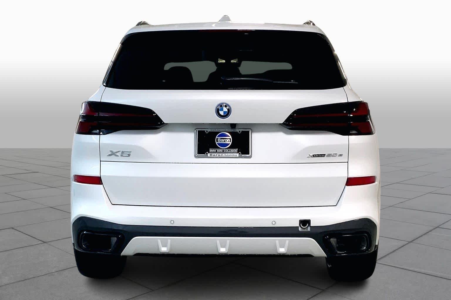 Used 2026 Mineral White Metallic BMW xDrive50e image 4