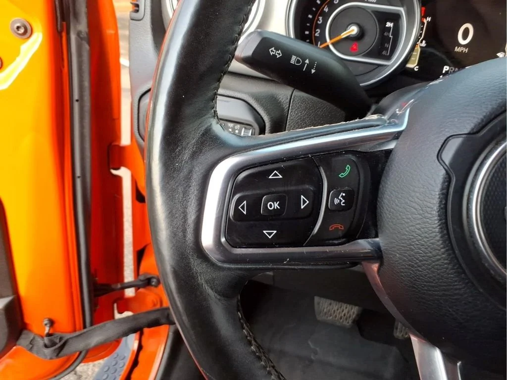 Used 2018 Orange Jeep Unlimited Sahara image 19