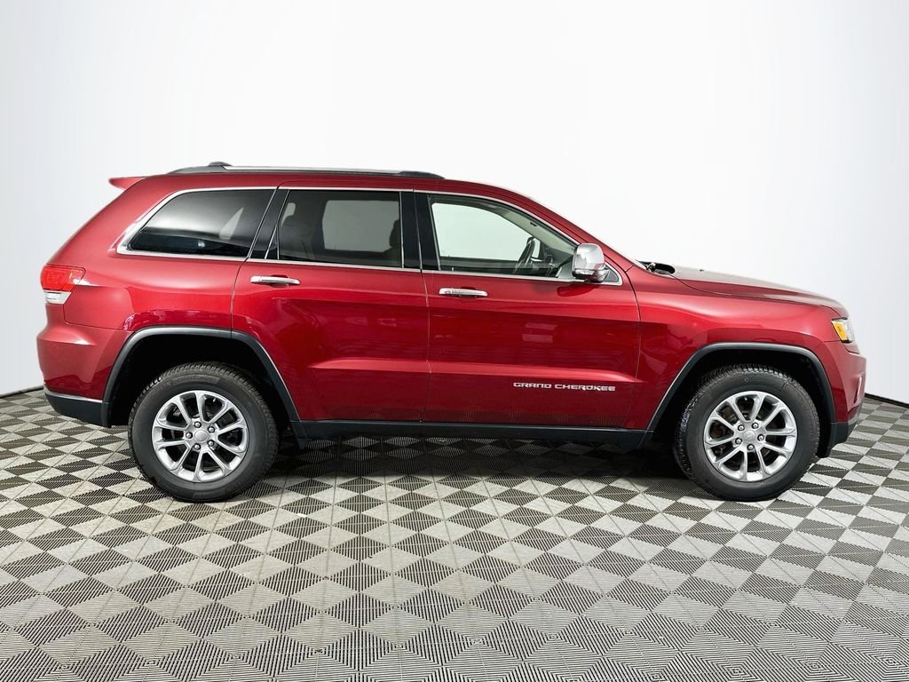 Used 2015 Deep Cherry Red Crystal Jeep Limited image 4