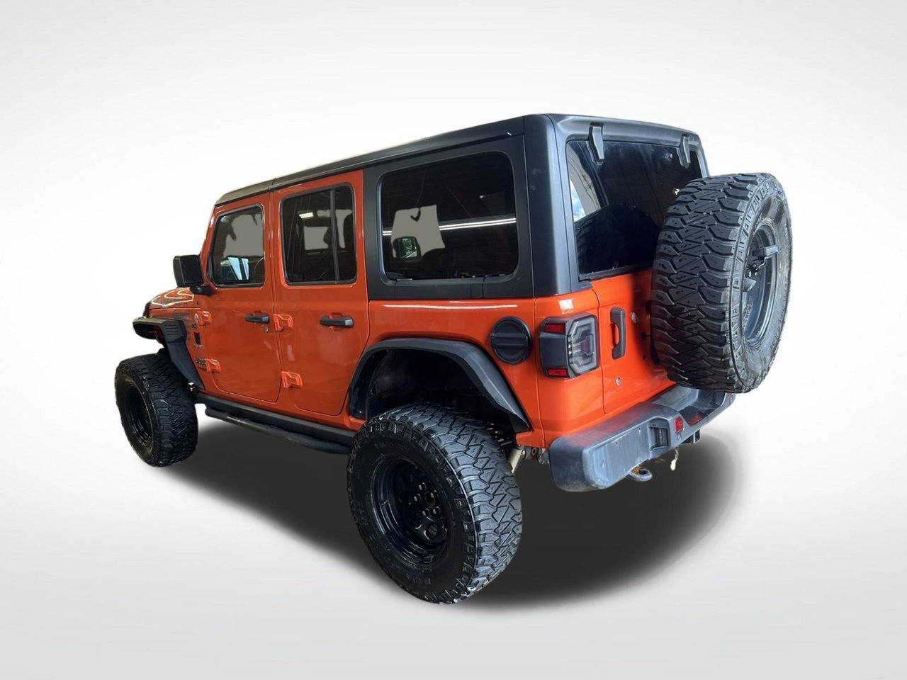 Used 2020 Orange Jeep Unlimited Sahara image 4