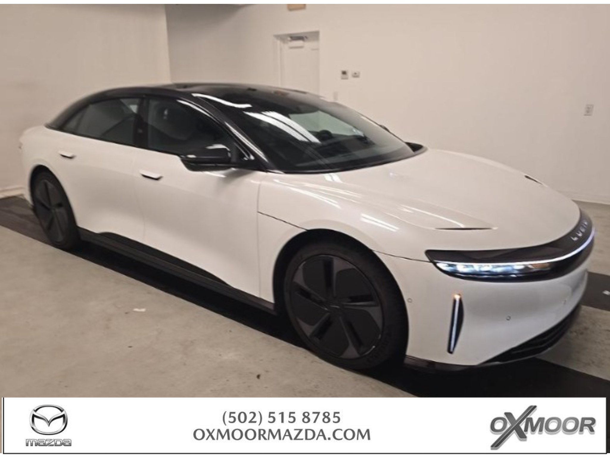 Used 2023 Stellar White Metallic Lucid Touring image 1