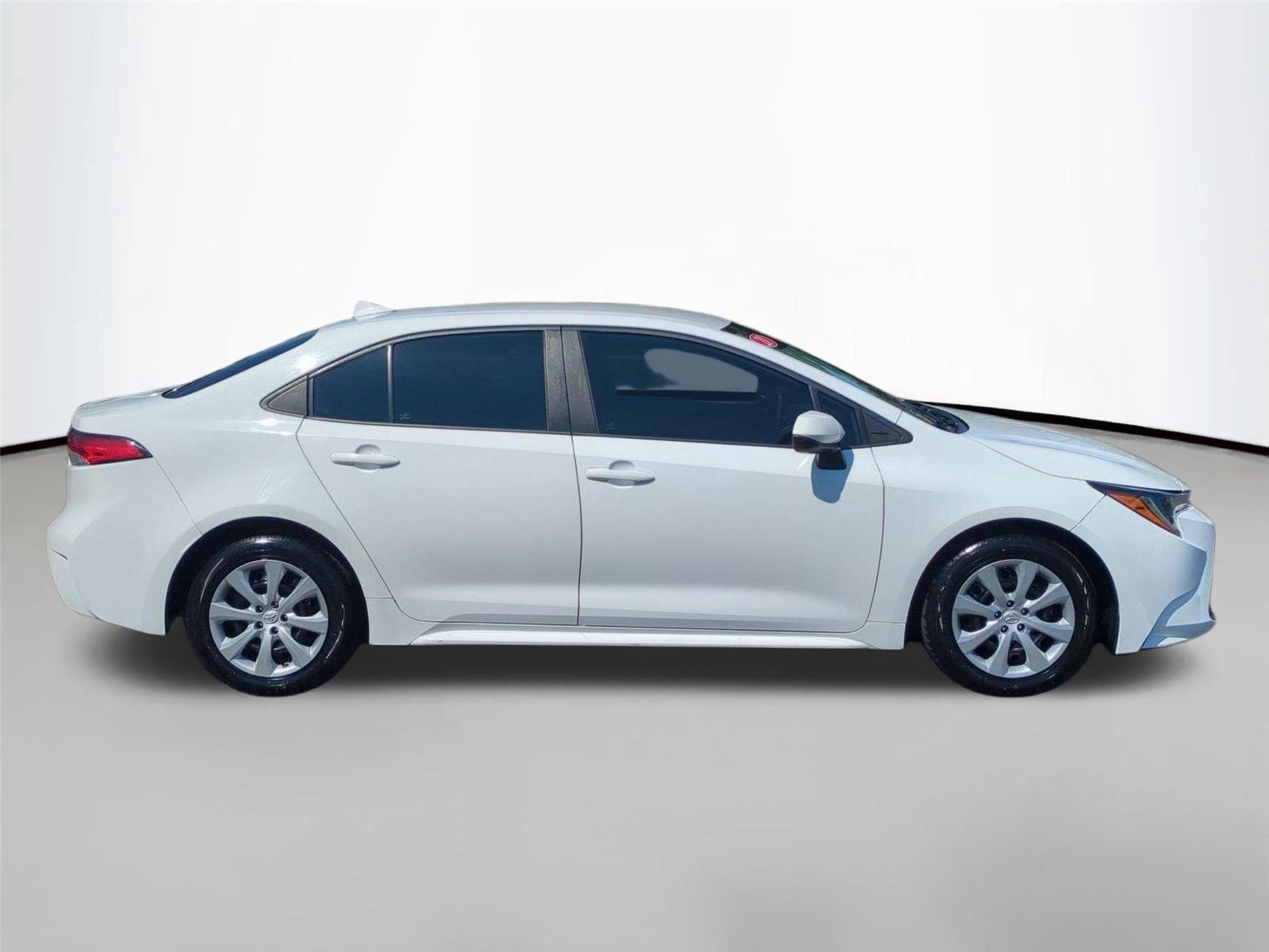 Used 2021 Super White Toyota LE image 6